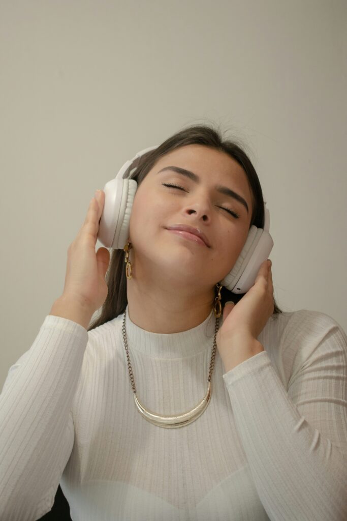 A girl in the white dress listening to music A girl in the white dress listening to music