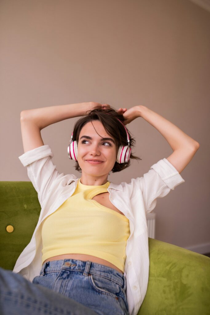 A girl in white and yellow listening to romantic ringtones